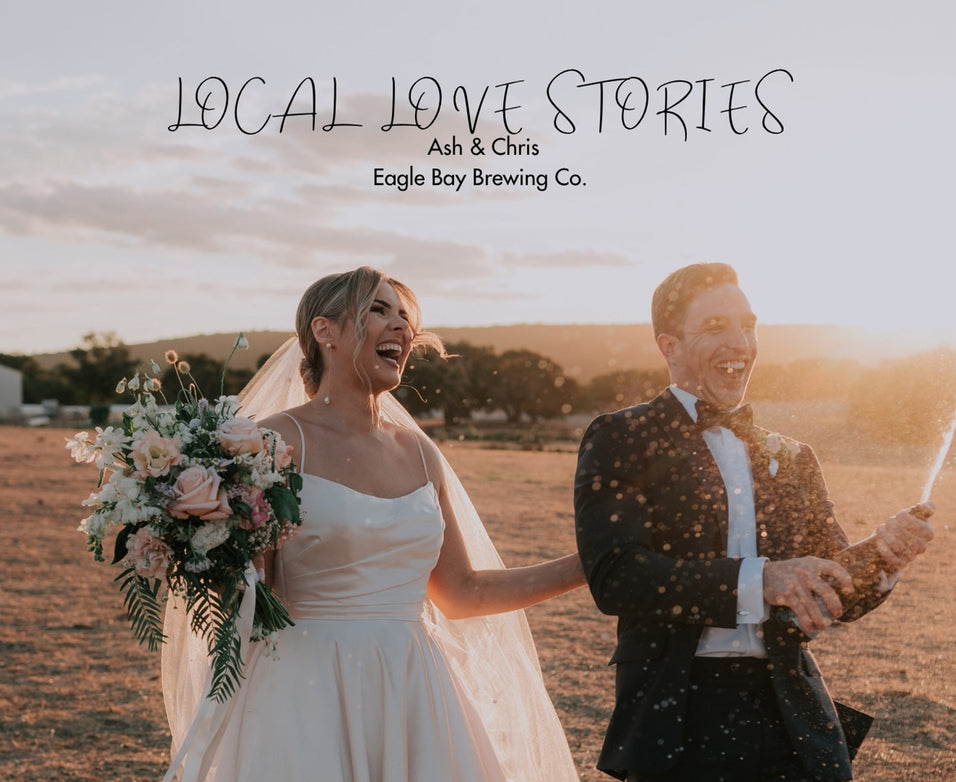 A newly married couple celebrating their wedding popping a bottle of Eagle Bay Brewing Co Champagne on the farm property.
