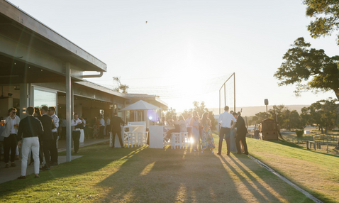 The Eagle Bay Brewing Co outdoor Garden Bar setting with people enjoying a beer and wine