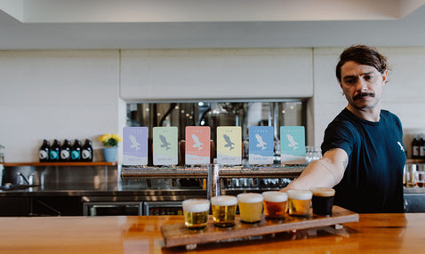 Eagle Bay Brewing Co Beer tasting paddle at the indoor bar.