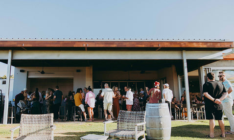Eagle Bay Brewing Co Garden Bar with people having a beer and wine