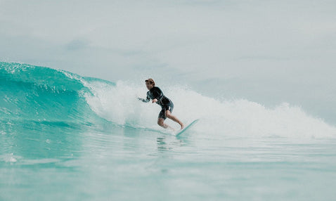 A person surfing the Eagle Bay Brewing Co region.