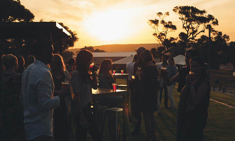 Eagle Bay Brewing Co - outdoor Beer garden at sunset