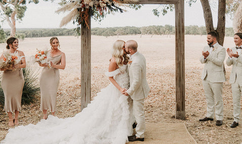 Couple standing at the altar at Eagle Bay's wedding venue in the Margaret River region in a rustic, country setting