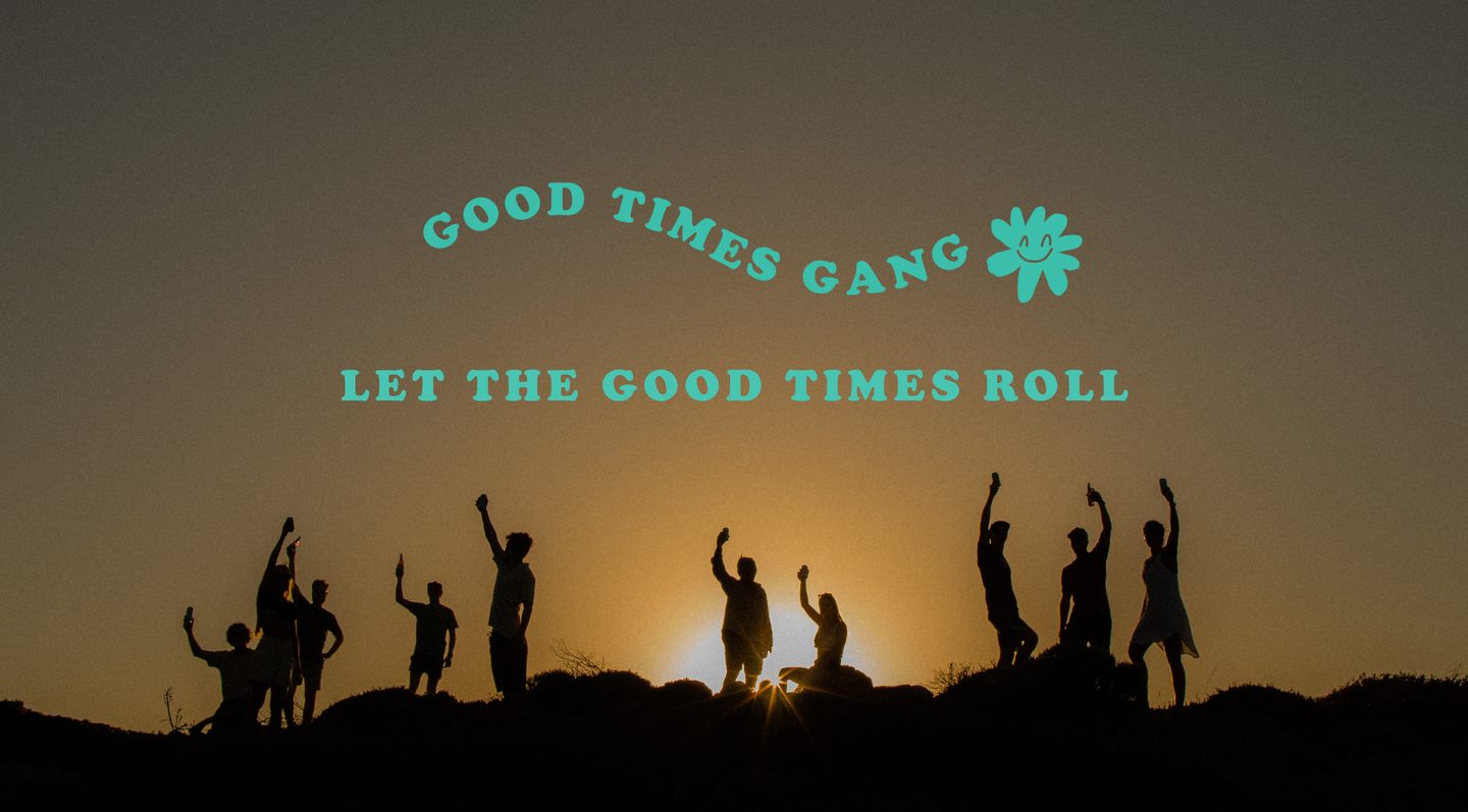 Silhouetted group of people jumping and celebrating against a sunset sky, with turquoise text reading 'GOOD TIMES GANG LET THE GOOD TIMES ROLL' and a flower icon across the center.